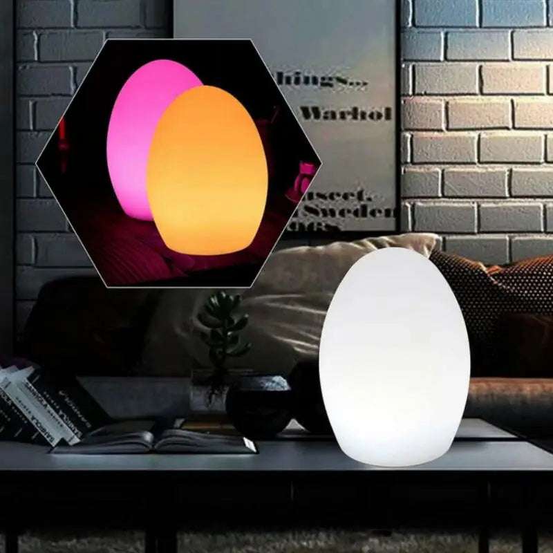 LED Rechargeable RGB Night Light in Egg ShapeThis unique LED Night Light is both sophisticated and versatile, perfect for enhancing indoor and outdoor settings. Resembling a sleek egg, this USB rechargeable lam1724LED Rechargeable RGB Night Light