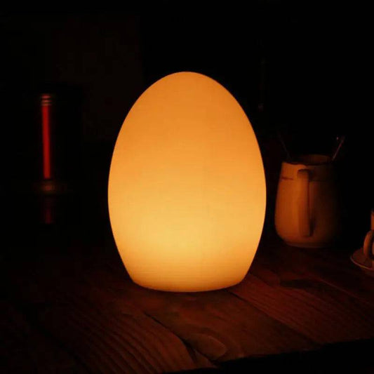 LED Rechargeable RGB Night Light in Egg ShapeThis unique LED Night Light is both sophisticated and versatile, perfect for enhancing indoor and outdoor settings. Resembling a sleek egg, this USB rechargeable lam1724LED Rechargeable RGB Night Light